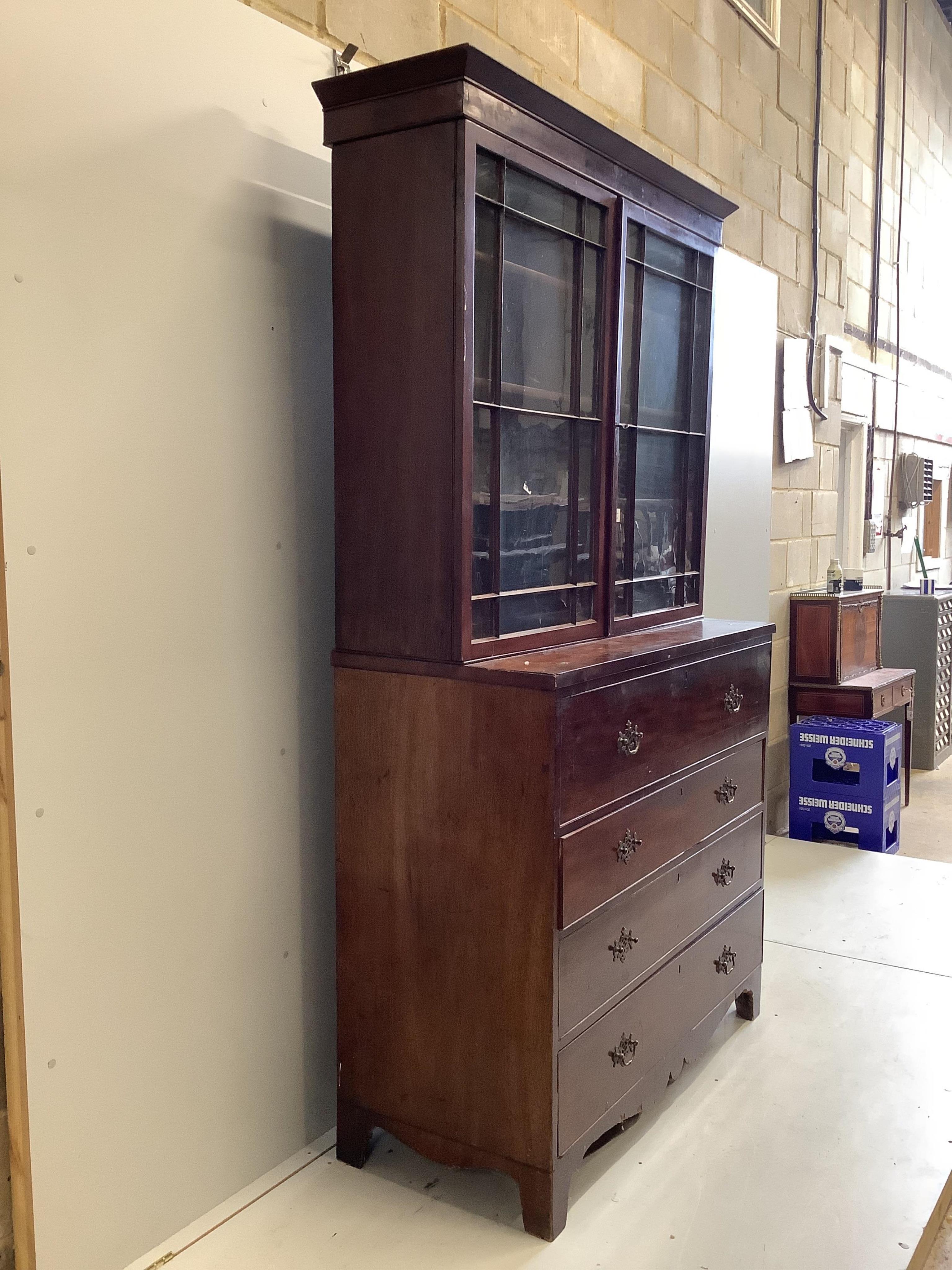 A Regency mahogany secretaire chest, with a later glazed bookcase over, width 121cm, depth 53cm, height 221cm. Condition - poor